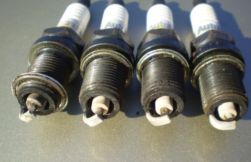 Understanding Why Spark Plug Tips Turn White and How to Clean Them